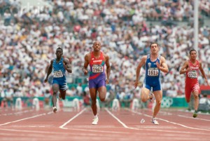 26 Jul 1996, Atlanta, Georgia, USA --- Men run in a preliminary heat of the men's 100 meter dash at the 1996 Olympics. From left: Robert Loua, Guyana; Frank Fredericks, Namibia (who went to to win the silver medal in this event); Alexandros Yenovelis, Greece; and Mark Sherwin, Cook Islands. --- Image by © Wally McNamee/CORBIS